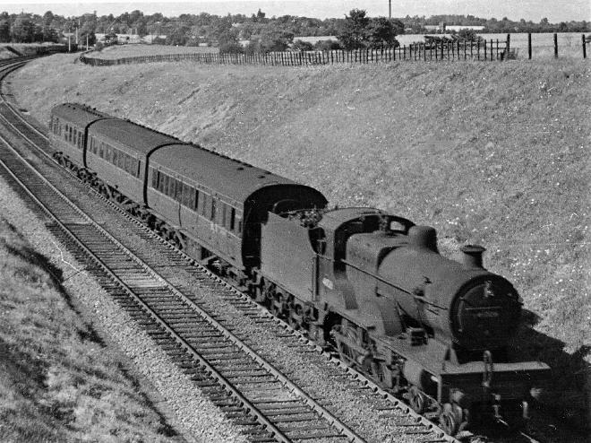 Train passing near Besford Station