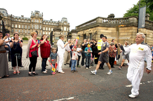 Bowes Museum, Barnard Castle - The Olympic Torch comes through the town. Jack Besford carrying the torch. Picture by Chris Booth 20/06/2012