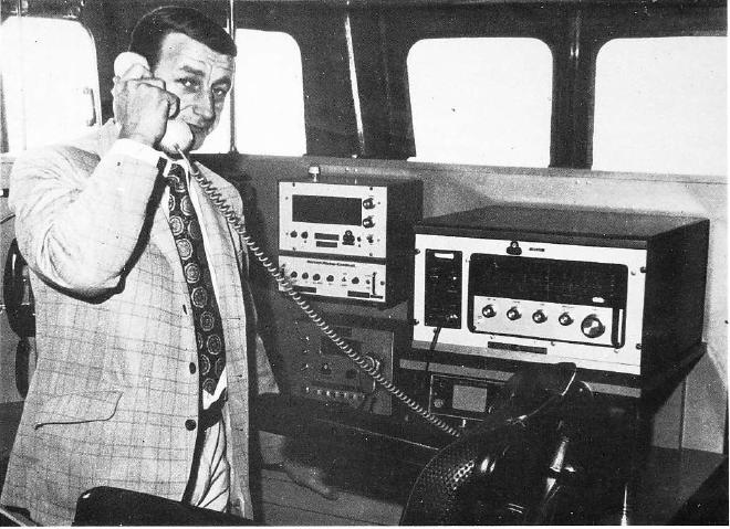 Skipper David Besford in the wheelhouse of the new St. Patrick, from Mariner, January–February 1976