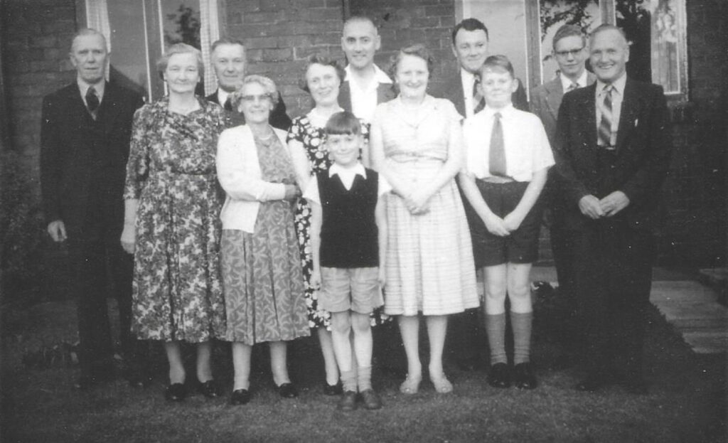 Left to right, Jack Besford, Maud Besford (wife of George Besford), George Besford, Rhoda Besford, Dora Hornsby (née Besford), John Hornsby aged 8, Harry Hornsby, Joan Besford (née Matthews), David Besford, Alan Besford, John Besford, David Besford. The person missing from the photo is David Besford (1946), who is likely to have taken the photo.